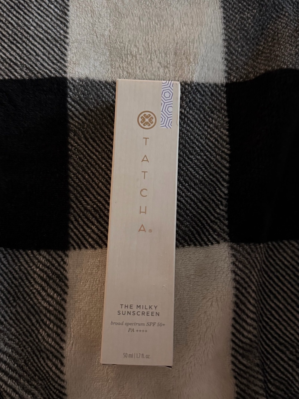 Tatcha Milky Sunscreen in Cream and Gold Packaging